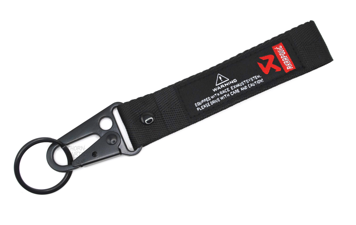 Schlüsselanhänger Akrapovic Motorrad schwarz rot Stoff Karabiner